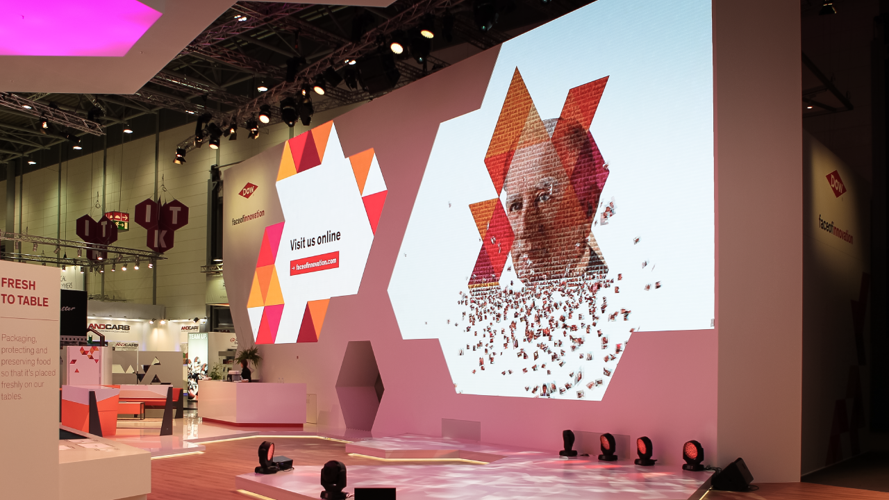 Real-time creation of a live digital photo mosaic in the form of a cut-off logo