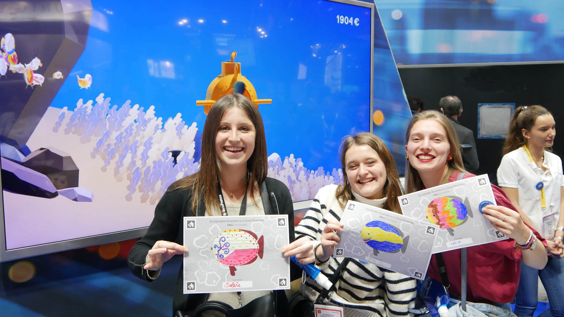 Participants show off their WE ARE COLORS™ coloring on the Dell stand at Vivatech