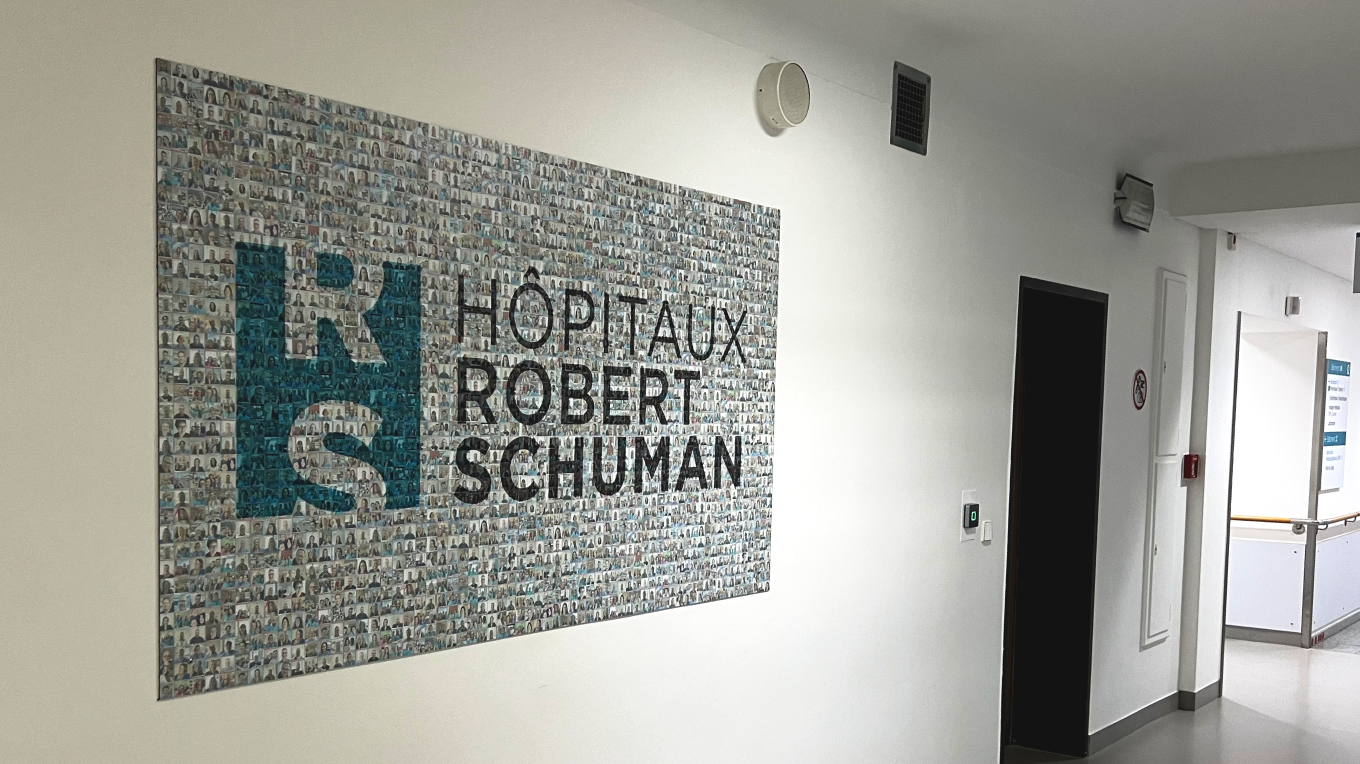 A printed photo mosaic featuring the Hôpitaux Robert Schuman logo and photos of employees to mark Diversity Week.
